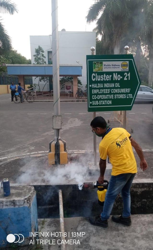 Strive International technician using fogging equipment outdoors
