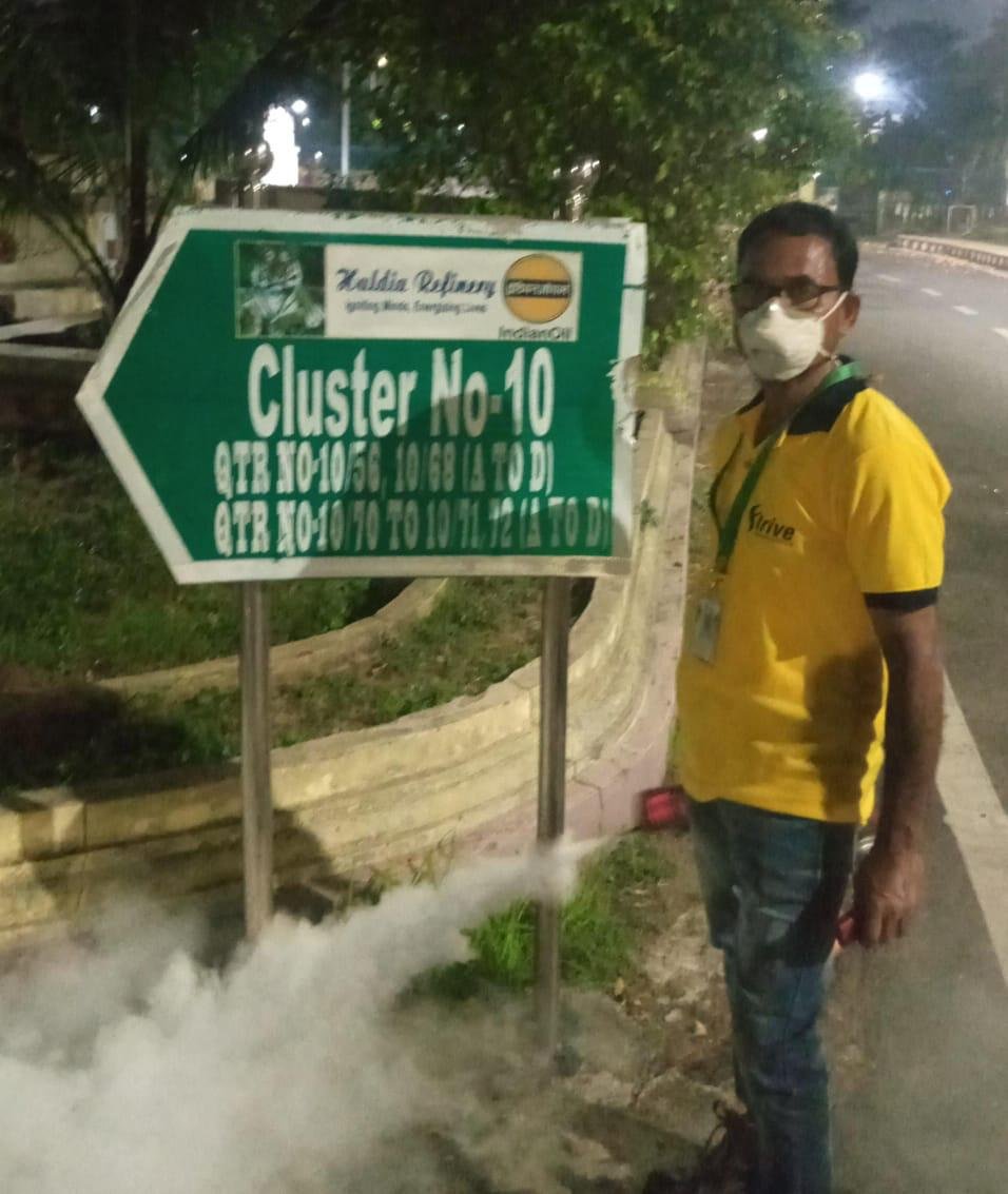 Strive International technician on site during outdoor pest-management work