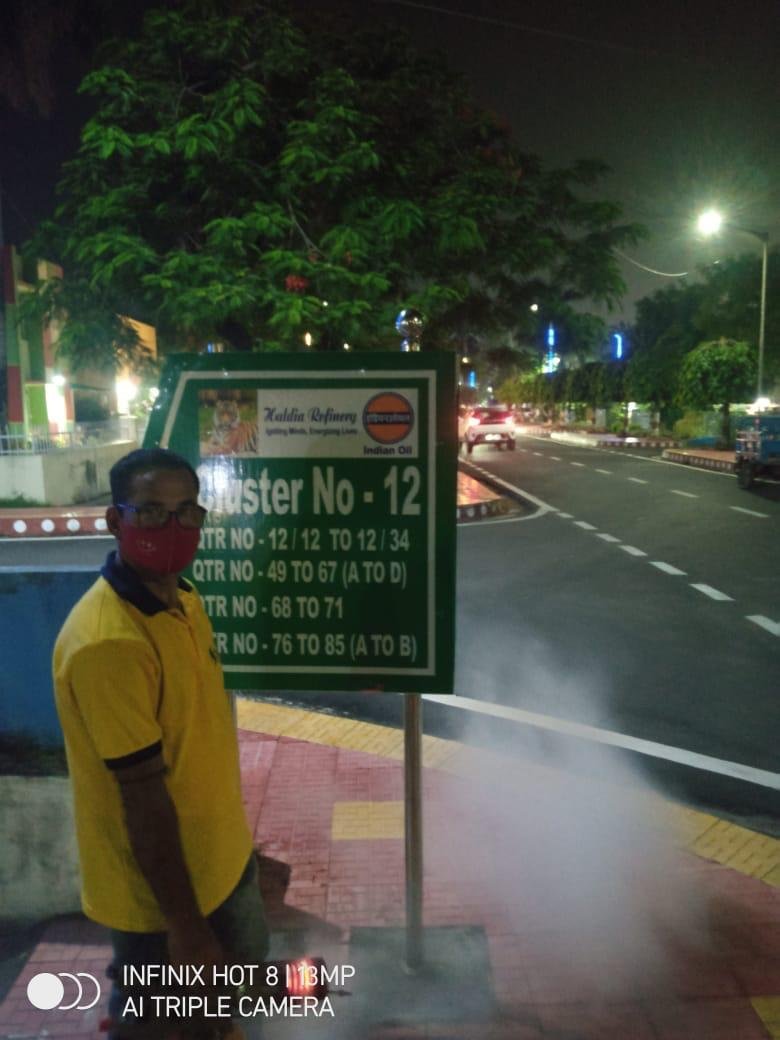 Strive International technician carrying out outdoor fogging near a facility