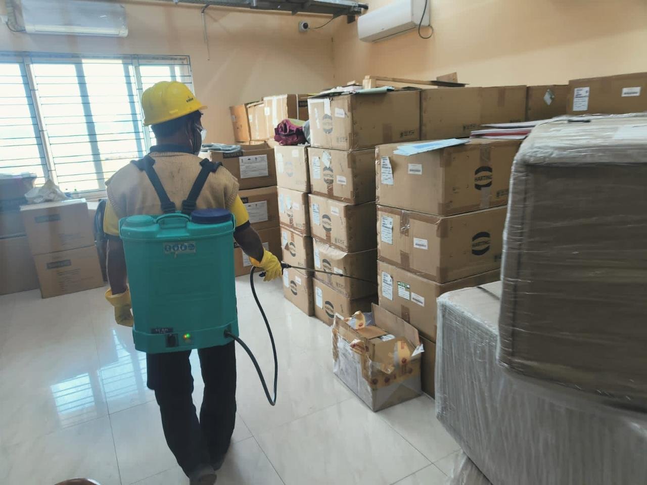 Strive technician treating a commercial storage and warehouse area